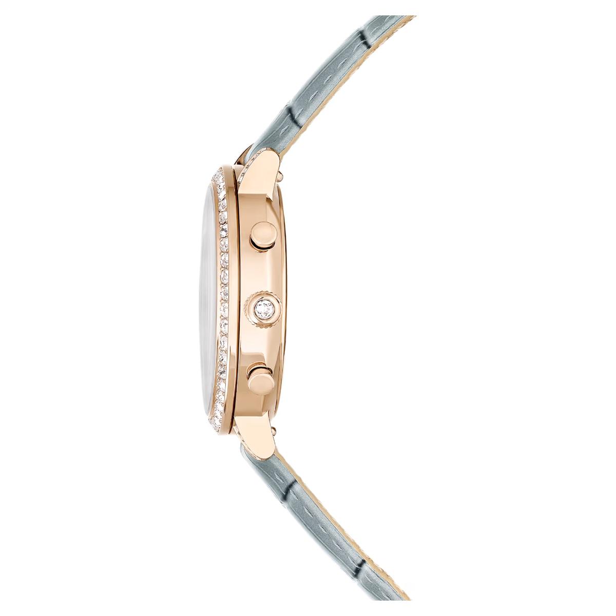 Close-up of a rose gold watch with a gray strap on a white background