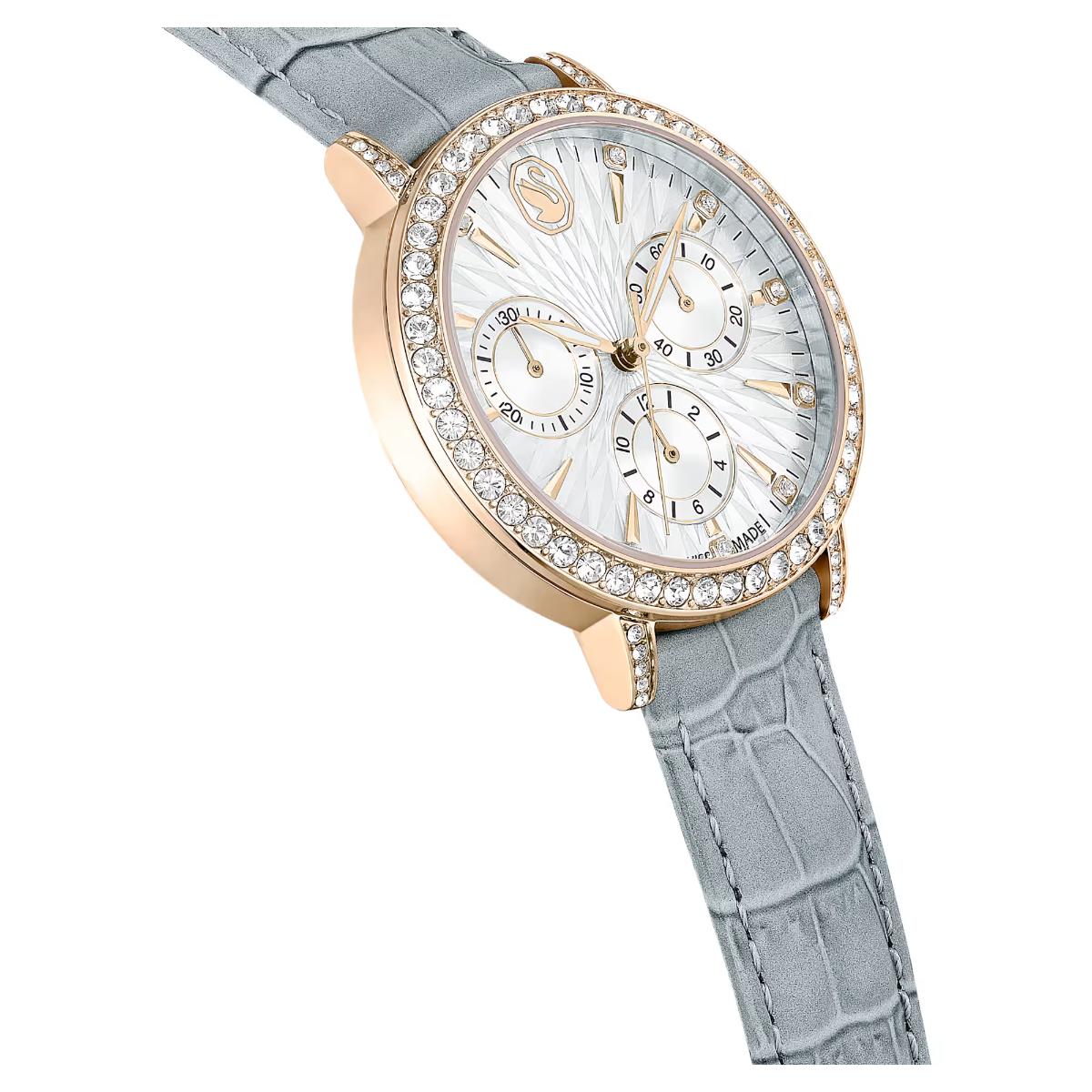 Luxury watch with rose gold case and gray strap on white background