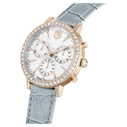 Luxury watch with rose gold case and light blue strap on a white background