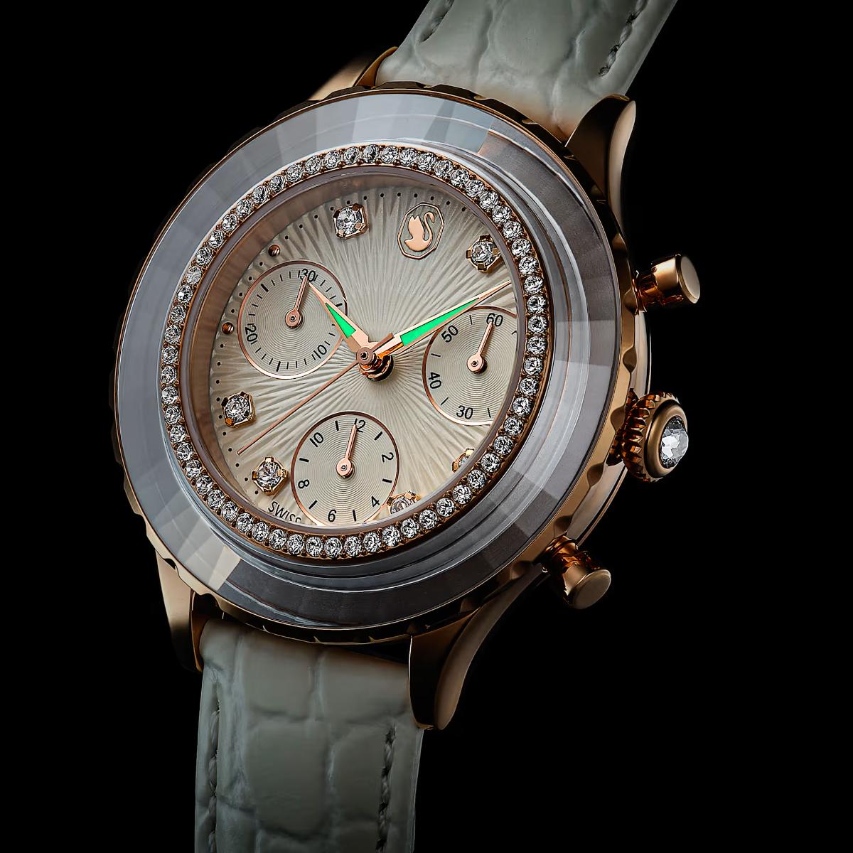 Luxury watch with diamond-studded face and green second hand on a black background