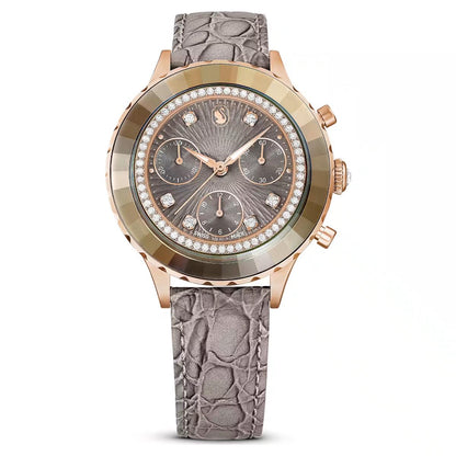 Luxury watch with rose gold case and gray strap on white background