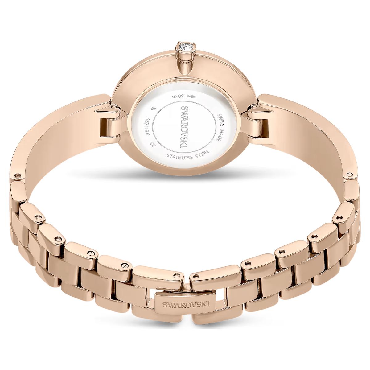 Rose gold Swarovski watch on a white background