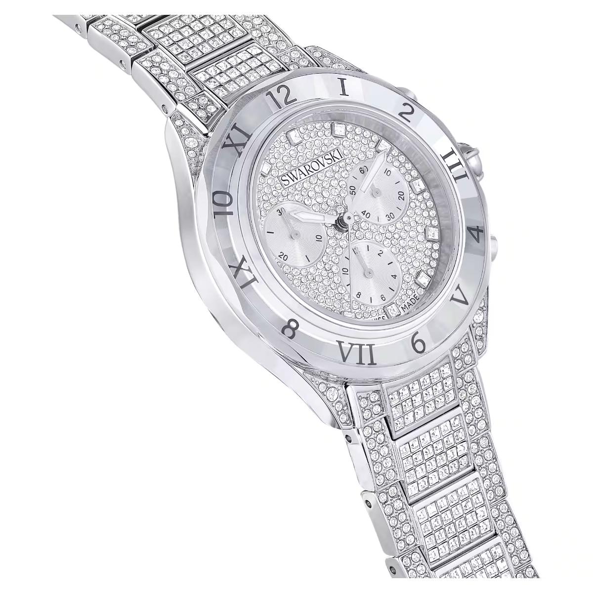 Silver Swarovski watch with diamond-studded band on a white background