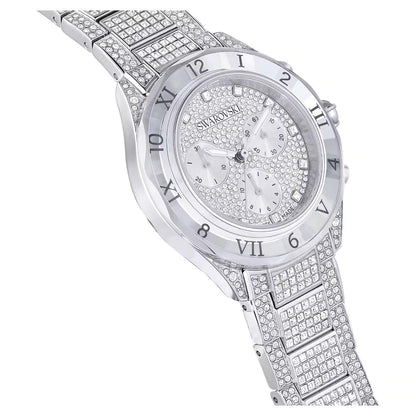Silver Swarovski watch with diamond-studded band on a white background
