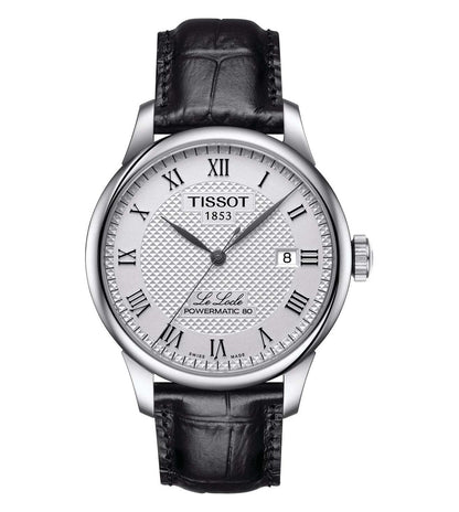A TISSOT men's watch with a round silver dial, black leather strap, and a silver case. Features include a date display and a traditional analog design.