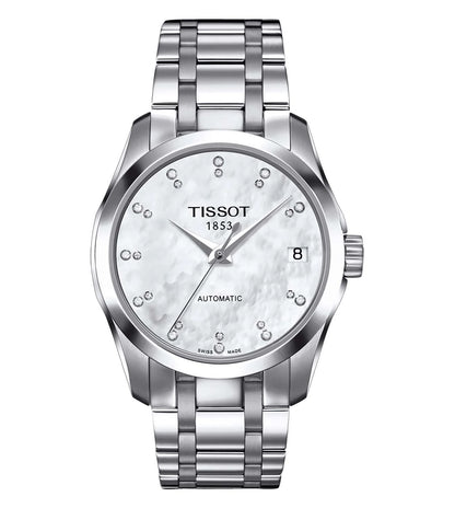 A TISSOT Couturier Automatic Lady watch with a round dial, stainless steel strap, and silver case.