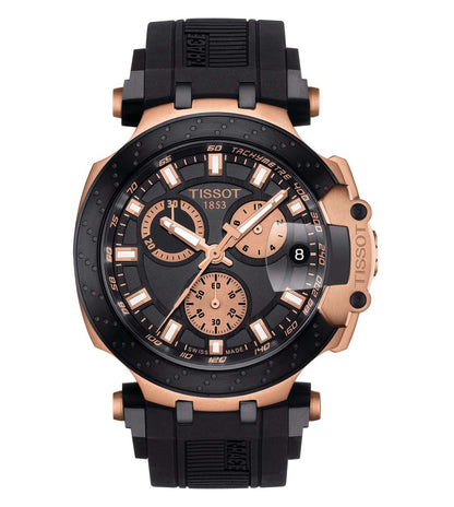 A TISSOT T-Race Chronograph Watch for Men featuring a black dial with rose gold hands and markers, a black silicone strap, and rose gold PVD-coated case.