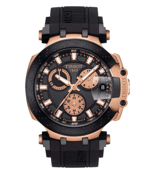 A TISSOT T-Race Chronograph Watch for Men featuring a black dial with rose gold hands and markers, a black silicone strap, and rose gold PVD-coated case.