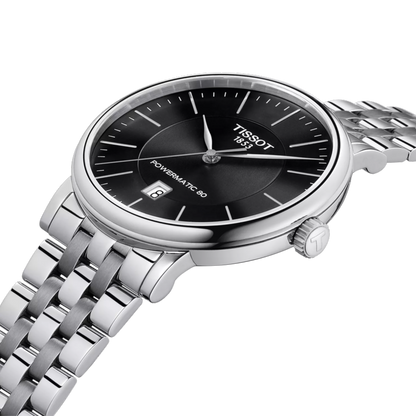 Tissot watch with black dial and silver metal bracelet on a white background