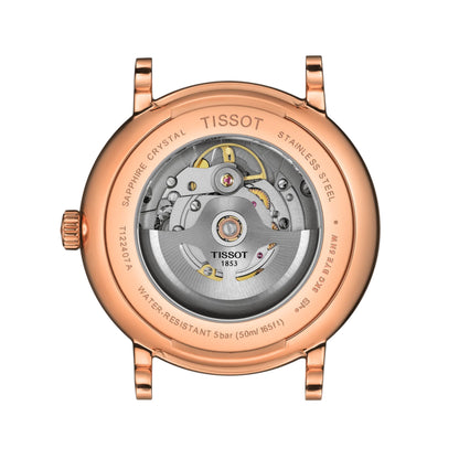 Rose gold Tissot watch with visible mechanism on a white background