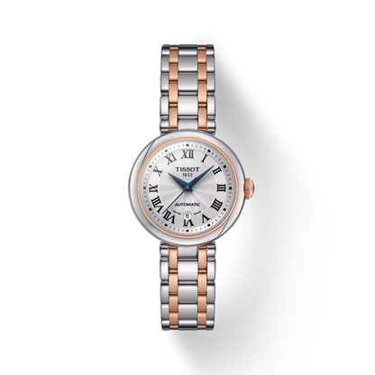 Tissot watch with silver and rose gold band on a white background