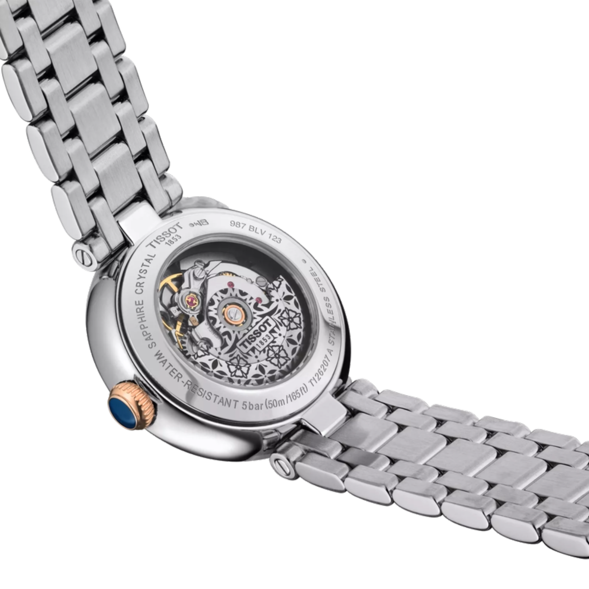 Close-up of a silver watch with a detailed mechanical movement on a white background