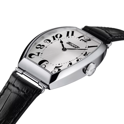 Wristwatch with black leather strap and silver case on a white background