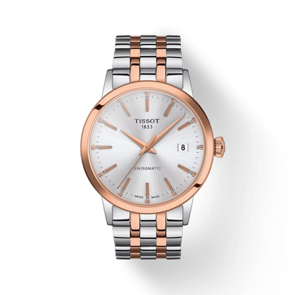 Tissot watch with two-tone rose gold and silver bracelet on a white background