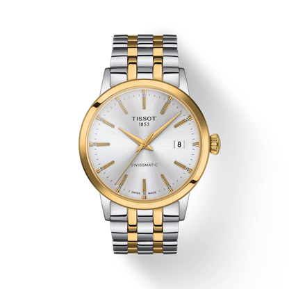 Tissot watch with two-tone metal strap on a white background