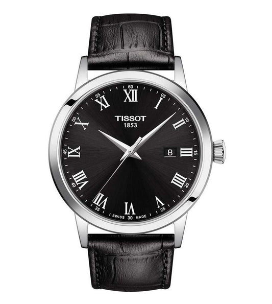 A TISSOT CLASSIC DREAM men's analog watch with a black dial, silver case, and black leather strap.