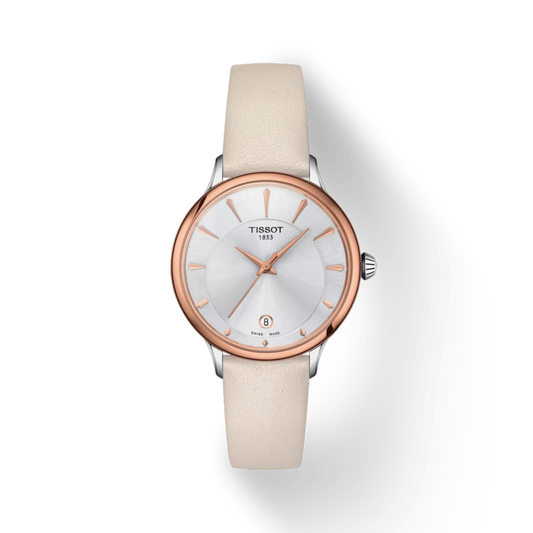Tissot watch with beige strap and rose gold case on white background