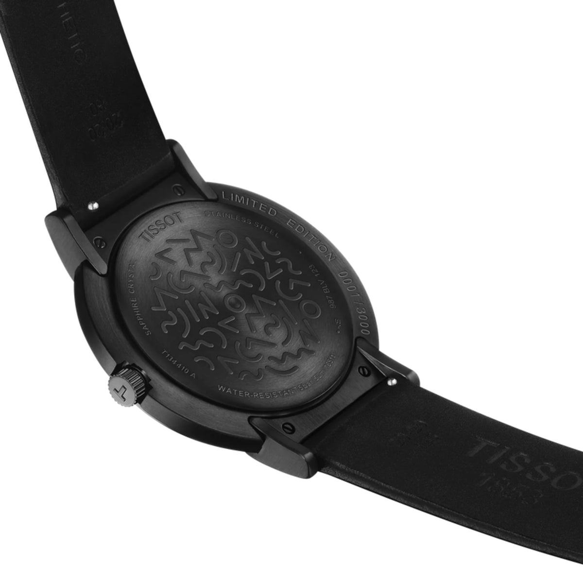 Black Tissot watch with detailed case back on a white background