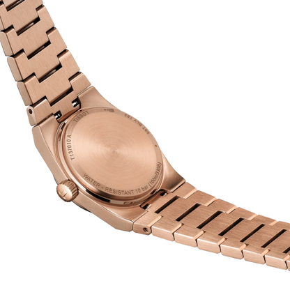 Rose gold watch with metal band on a white background