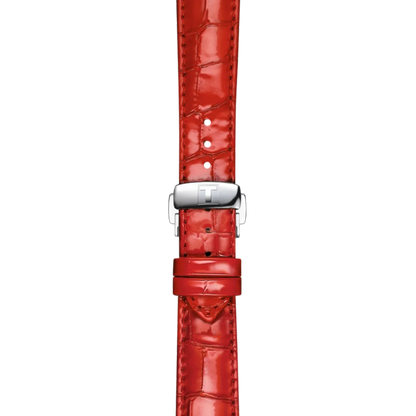 Red crocodile-patterned watch strap with silver buckle on a white background