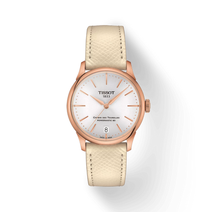 Tissot watch with beige strap and rose gold case on a white background