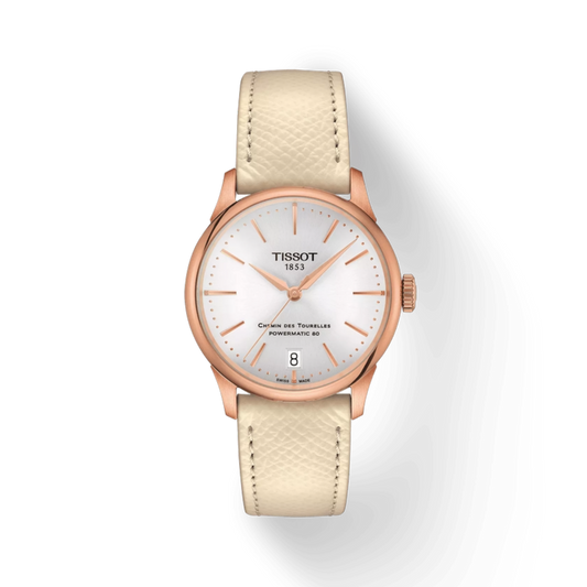 Tissot watch with beige strap and rose gold case on a white background