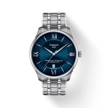 Tissot watch with blue dial and silver metal bracelet on a white background
