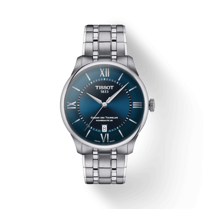 Tissot watch with blue dial and silver bracelet on a white background