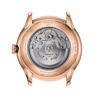 Rose gold Tissot watch with mechanical movement on a white background