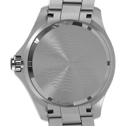 Silver watch with a detailed back design on a white background