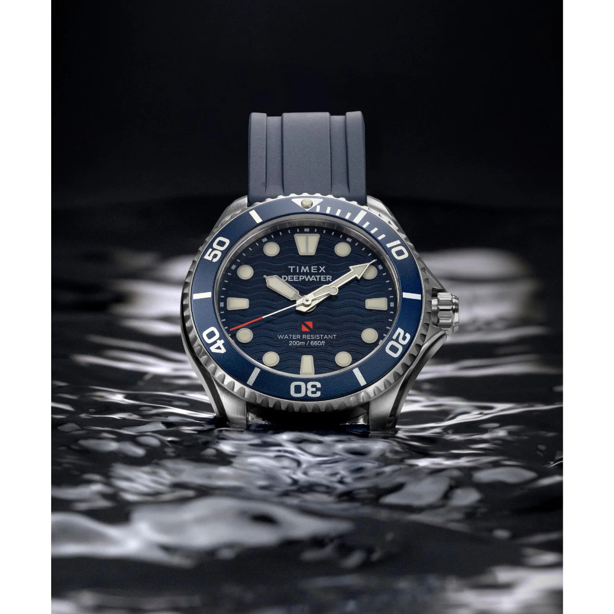 Timex watch with blue strap and face on a dark background