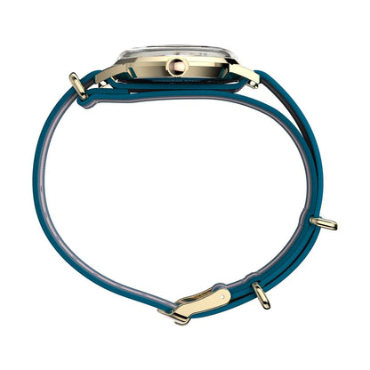 Close-up of a watch with a blue strap and gold accents on a white background