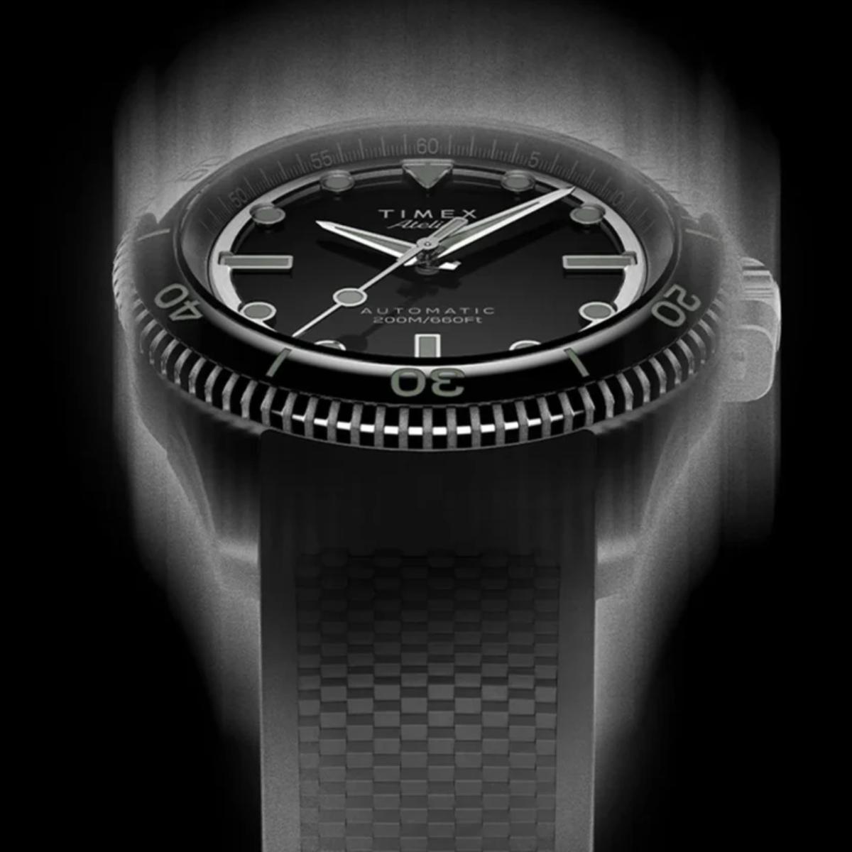 Black Timex watch with a detailed face and textured strap on a dark background