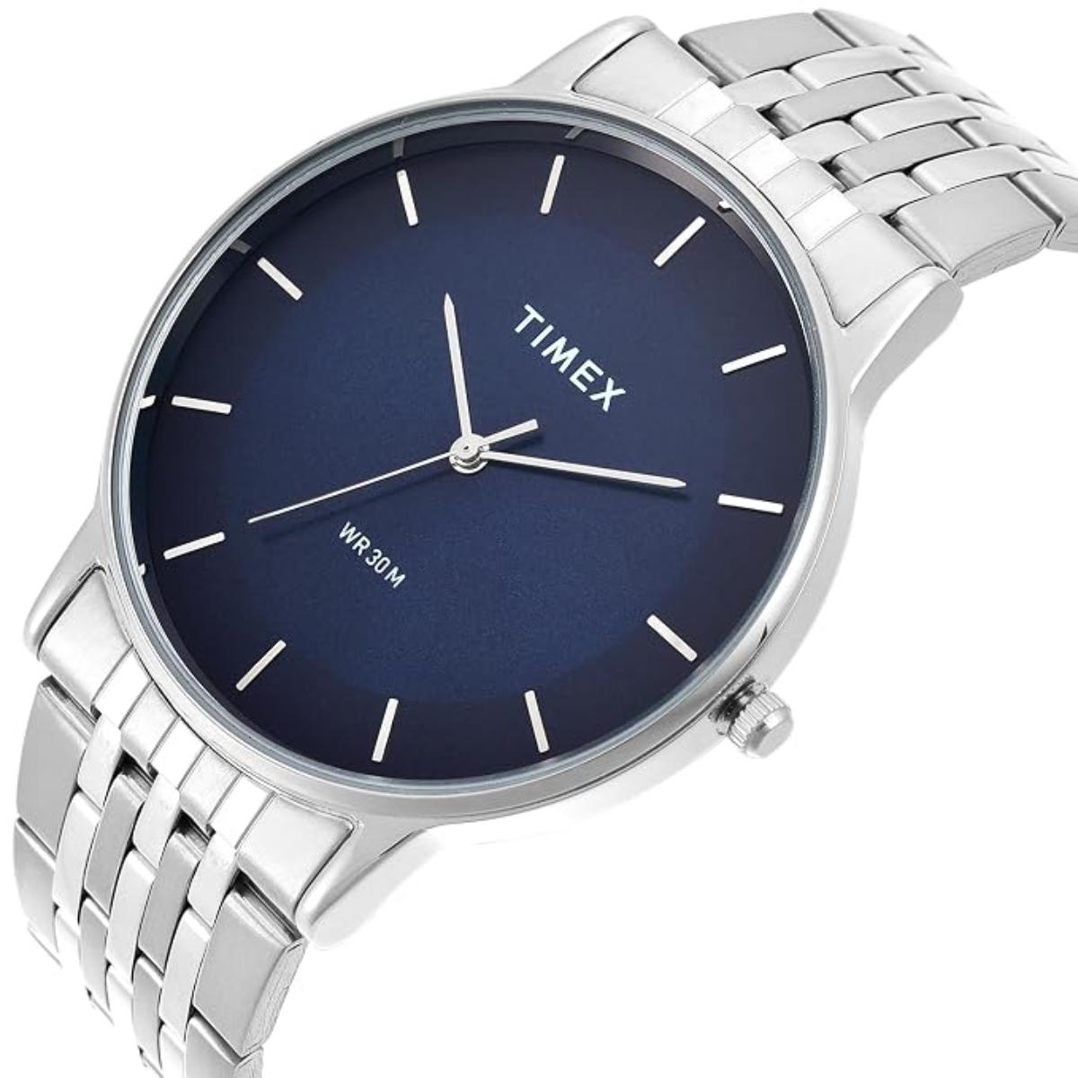 Timex watch with silver metal strap and blue dial on a white background