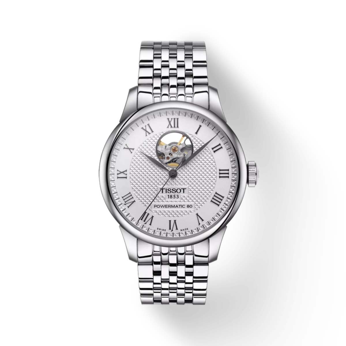 Silver Tissot watch with a white face on a light gray background