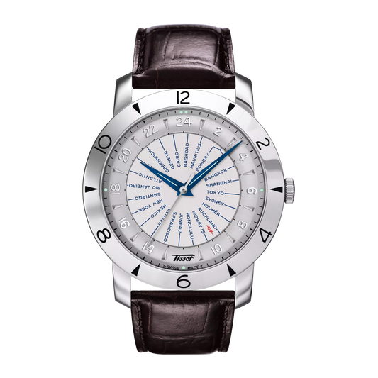 A Tissot Heritage Navigator Automatic men's watch with a white dial, blue hands, and a brown leather strap.