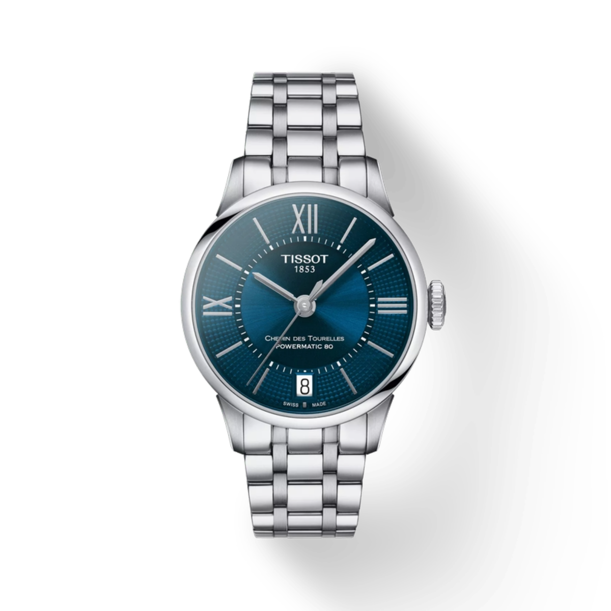 Tissot watch with blue dial and silver bracelet on a white background