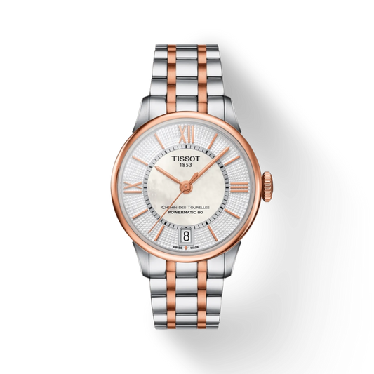 Tissot watch with silver and rose gold band on a white background