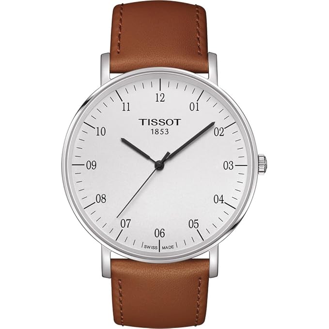 A Tissot T-Classic Everytime Swiss Quartz men's watch with a white dial and brown leather strap.
