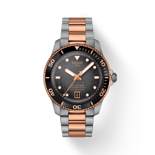 Tissot watch with rose gold and silver band on white background