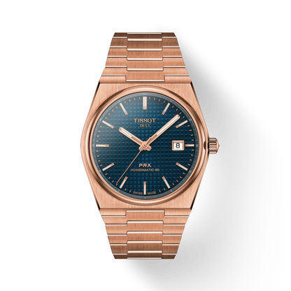 Rose gold Tissot watch with blue dial on a white background