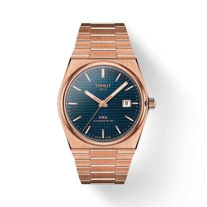 Rose gold Tissot watch with blue dial on a white background