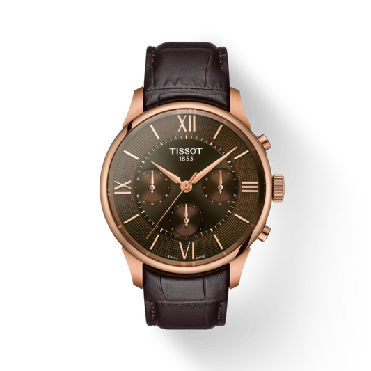 Tissot watch with black leather strap and rose gold case on white background
