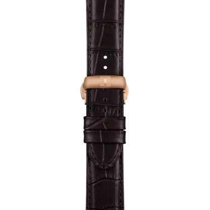 Brown crocodile leather watch strap with rose gold clasp on a white background