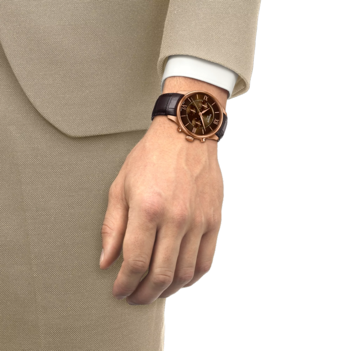 Hand wearing a watch with a detailed face, dressed in a beige suit on a white background