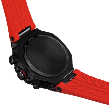 Close-up of a watch with a red strap on a white background