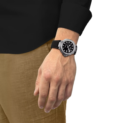 Hand wearing a black watch with a white background