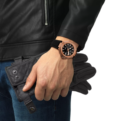 Hand wearing a rose gold watch with a black strap, holding a black leather wallet against a white background.