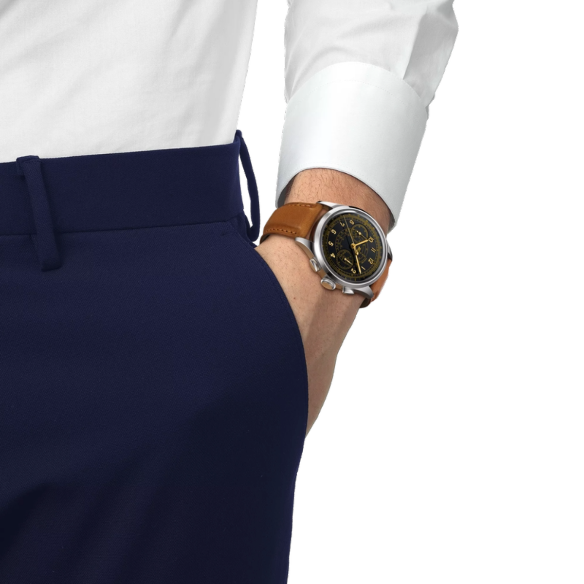 Person wearing a white shirt, navy pants, and a brown leather watch on a white background