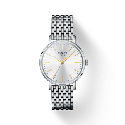 Silver Tissot watch with a white face on a white background